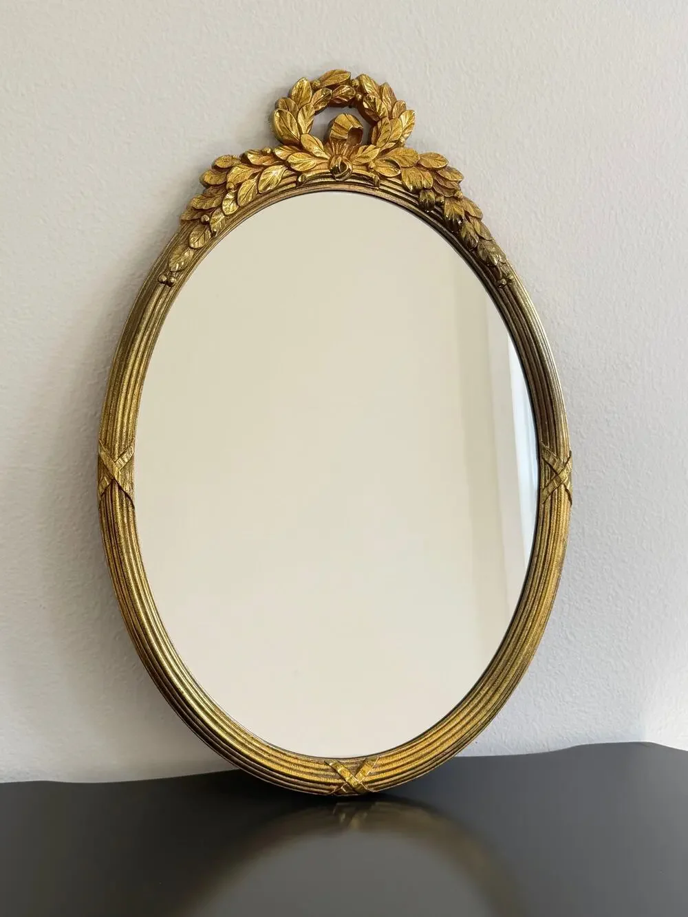 Vintage Hollywood Regency style mirror gold classic leaf wreath and ribbon crest